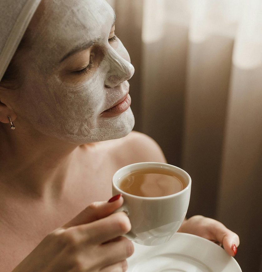 young-woman-having-face-massage-relaxing-spa-salon 1